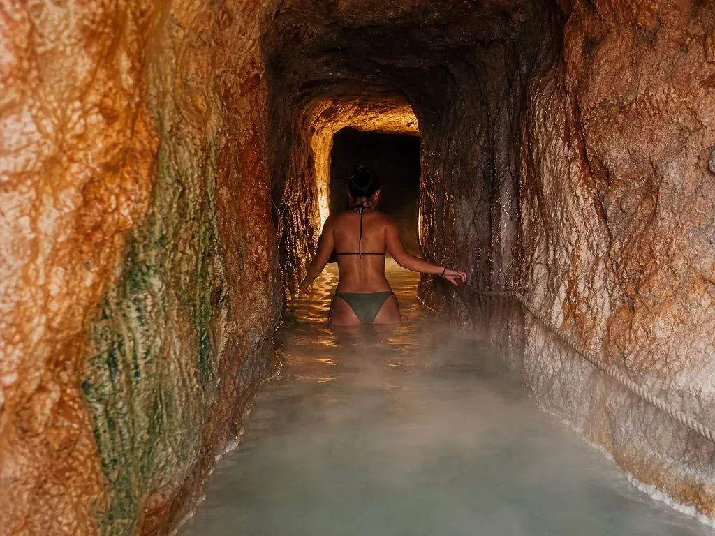 The tunnel section &mdash; warm water, rope handline, low light
